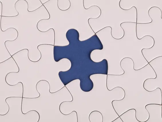 A image of a puzzle with one piece missing representing a challenge.